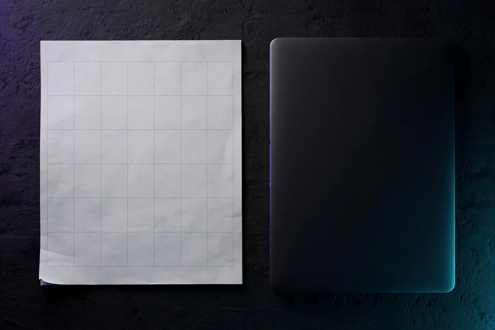 A blank calendar beside a laptop